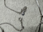 Spring ring clasp, extender chain and the Javeri House tag on the sterling silver layered necklace.