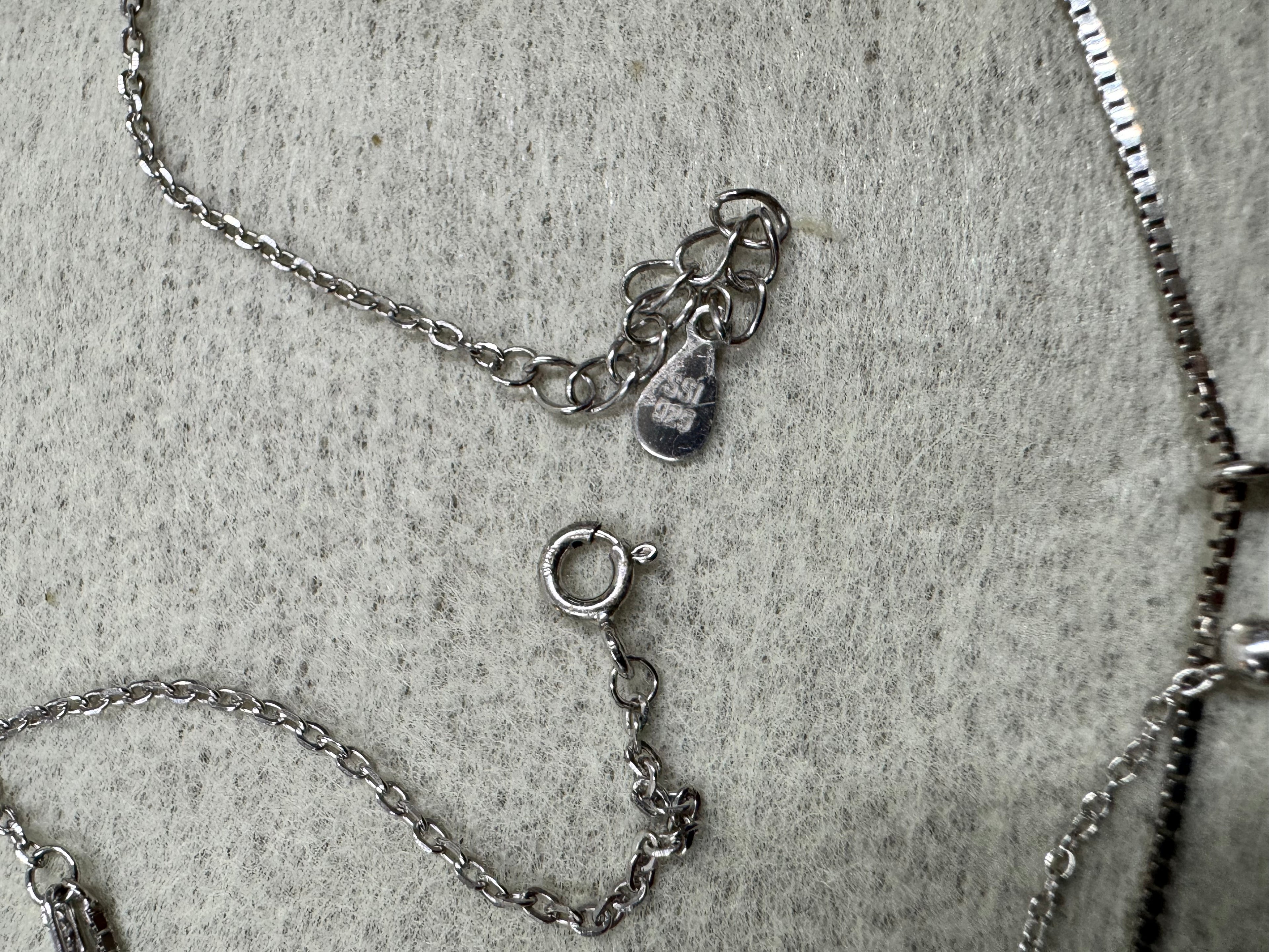 Spring ring clasp, extender chain and the Javeri House tag on the sterling silver layered necklace.