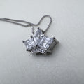 Sterling silver crown pendant necklace with three princess-cut American Diamonds, on a box chain.