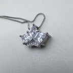 Sterling silver crown pendant necklace with three princess-cut American Diamonds, on a box chain.