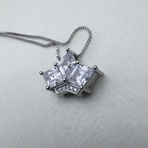 Sterling silver crown pendant necklace with three princess-cut American Diamonds, on a box chain.
