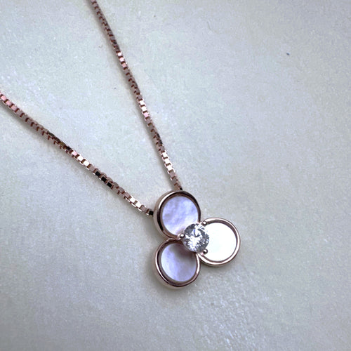 Rose-tone sterling silver pendant necklace with three mother of pearl petals and an American Diamond centre, on a box chain.