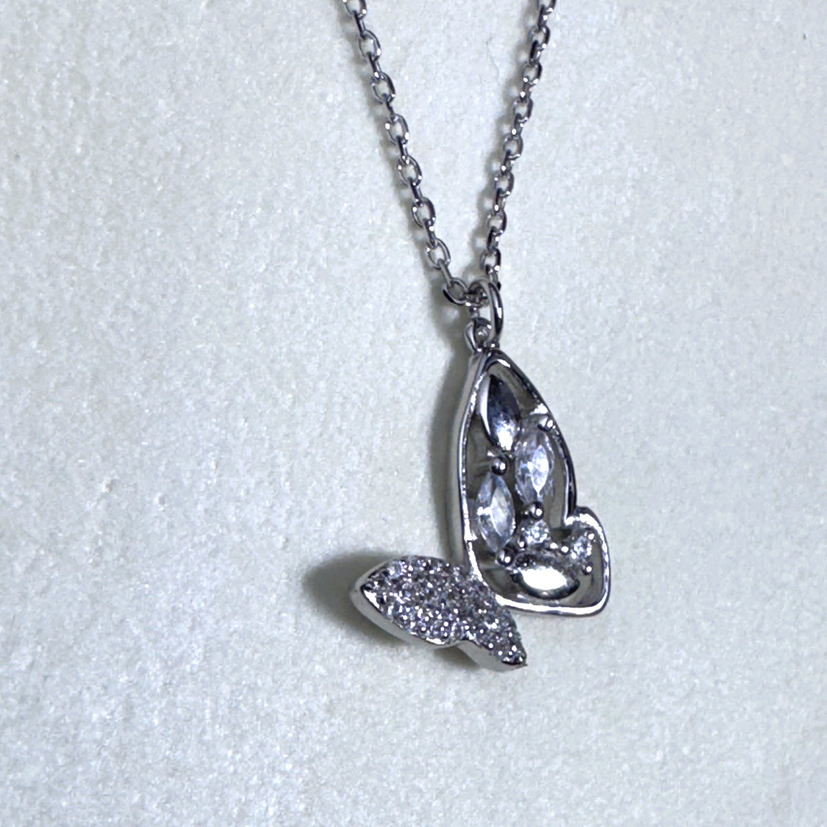 The butterfly pendant necklace seen from the other side.