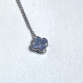 Sterling silver necklace with a small grey mother of pearl clover on a fine rolo chain.