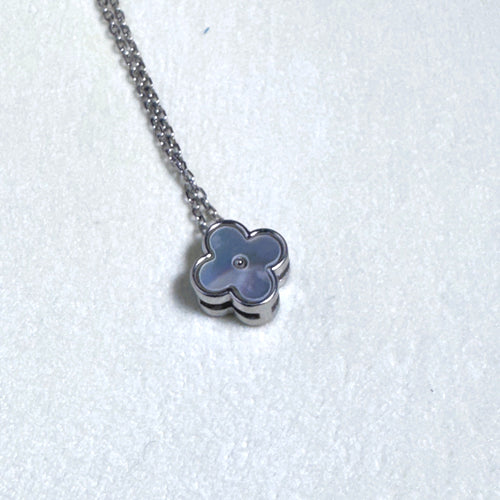 Sterling silver necklace with a small grey mother of pearl clover on a fine rolo chain.