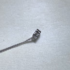 Side view of the clover slider on the rolo chain.
