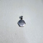 The plain polished silver back of the hexagon initial pendant.