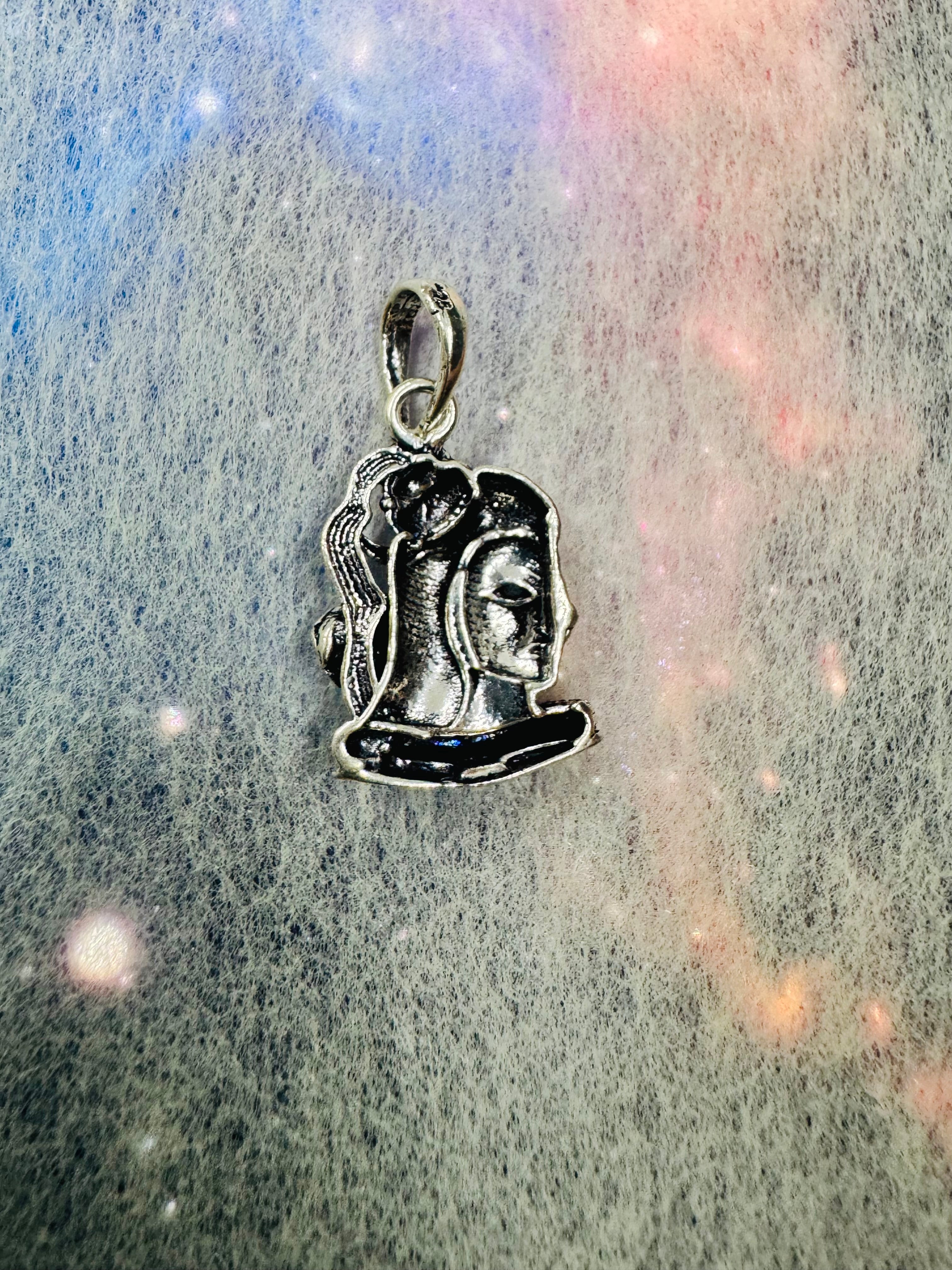 Reverse of the sterling silver Shiva pendant, showing the flatter back and the stamped oval bail.