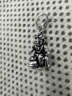 Close view of the crown, face and chest ornament on the sterling silver Bal Gopal pendant.
