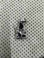 Reverse of the sterling silver pendant, showing the hollow oxidised back and the flat tapered bail.