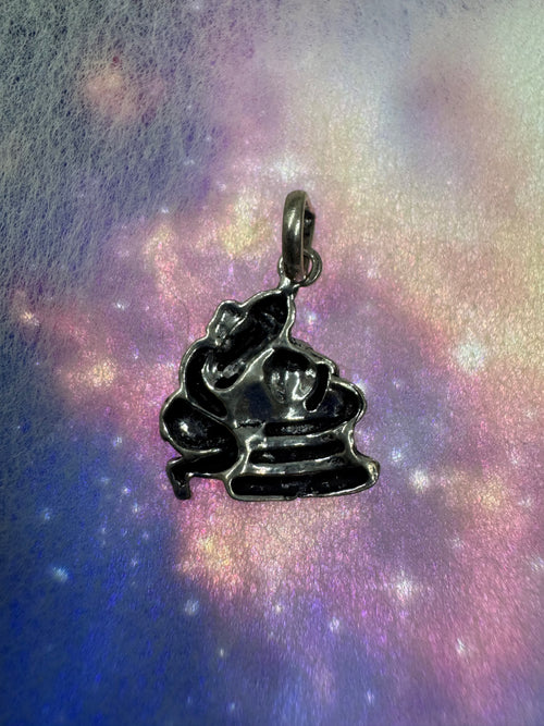 Reverse of the antique-finish sterling silver Ganesha pendant, showing the hollow back and the oval bail loop.