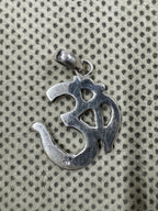 Reverse of the sterling silver Om pendant, showing the flat back and the 925 purity stamp.