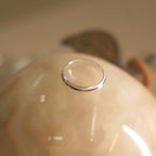 Angled view of the milgrain edge silver band, showing the rounded profile and beaded borders.