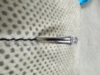 Sterling silver cubic zirconia ring viewed along the shank, the stone raised at the end of the tapering band.