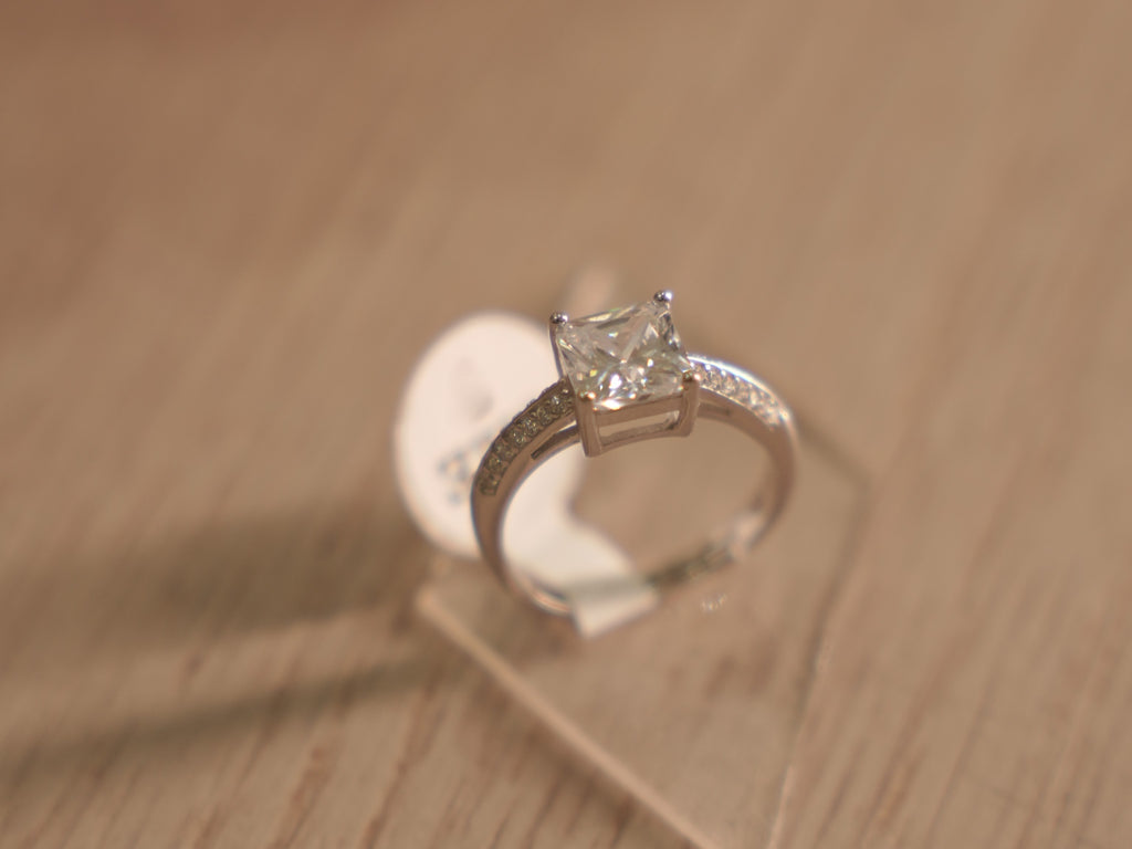 Side view of the American Diamond solitaire, showing the pave set shoulders.