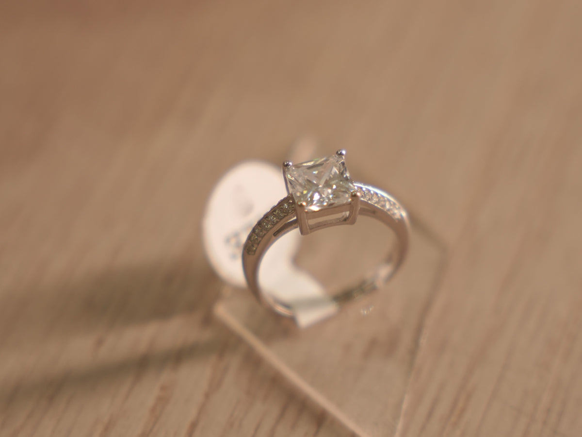 Side view of the American Diamond solitaire, showing the pave set shoulders.