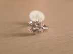 Sterling silver ring with an asscher cut American Diamond inside a starburst halo of marquise stones.