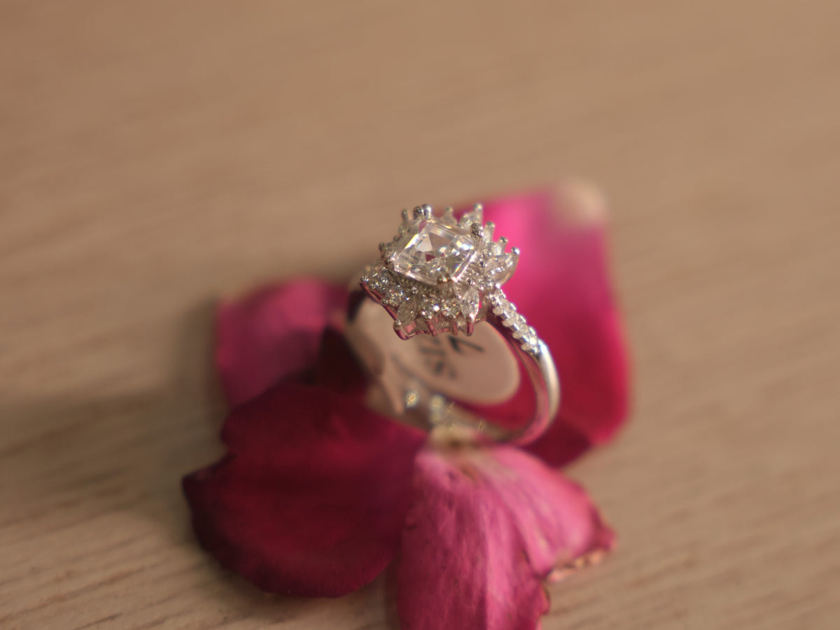 Close view of the starburst halo, showing the marquise and round American Diamond around the centre.