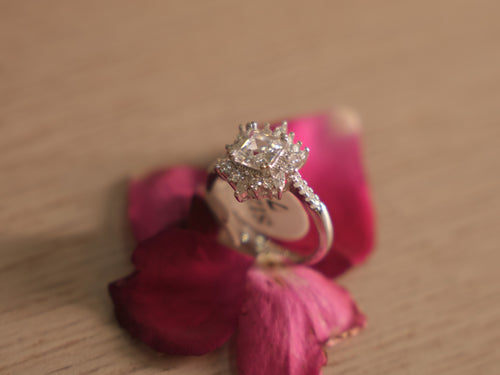 Close view of the starburst halo, showing the marquise and round American Diamond around the centre.