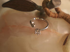 Close view of the open front of the ring, showing the crown set American Diamond.