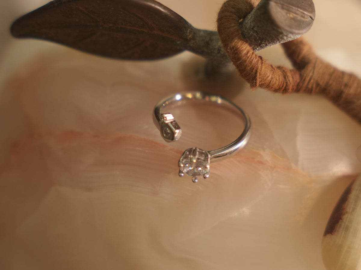 Close view of the open front of the ring, showing the crown set American Diamond.