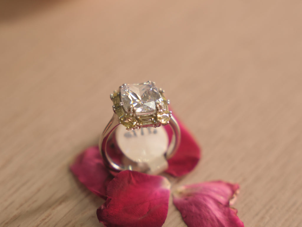 Side view of the cocktail ring, showing the split band under the frame.