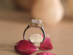 The crystal cocktail ring resting on a pale wooden surface.