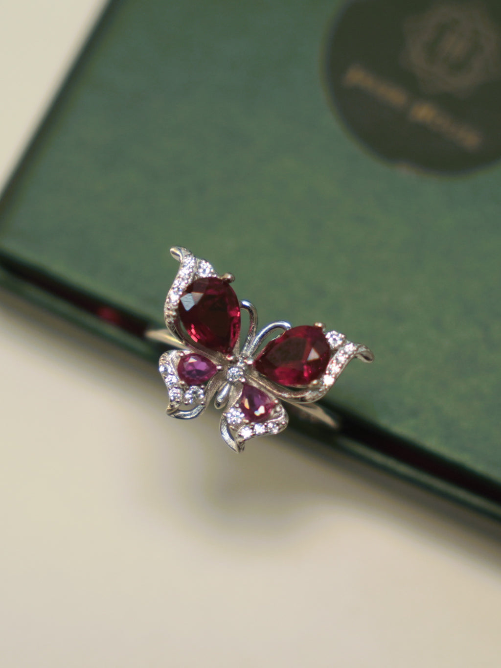 The butterfly ring seen from above, showing the pave set wing edges.