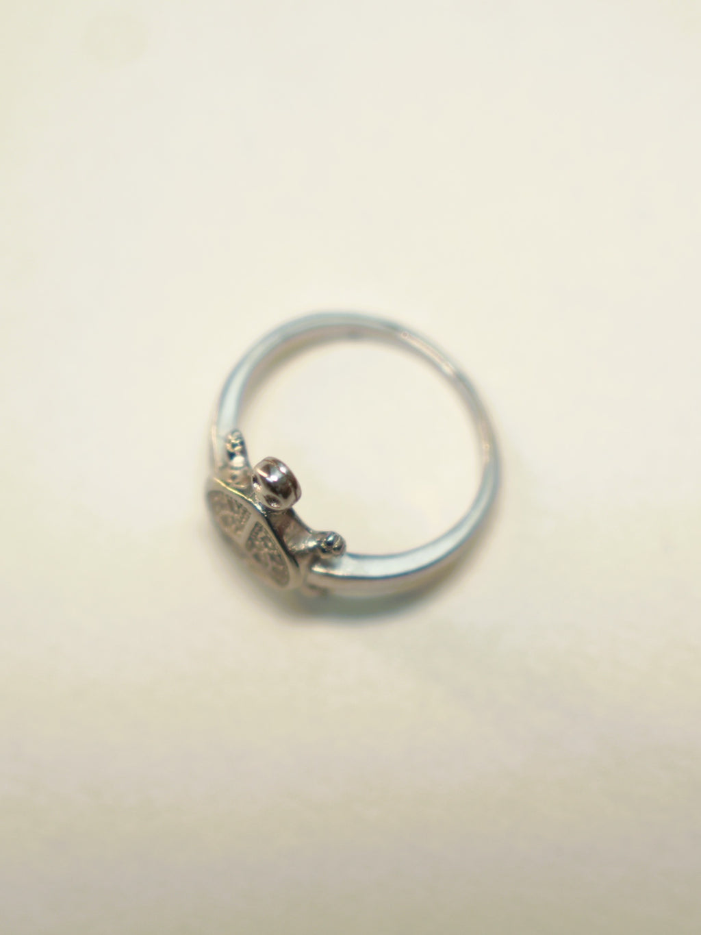 Side view of the small tortoise ring, showing the slim band.