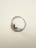 Side view of the small tortoise ring, showing the slim band.