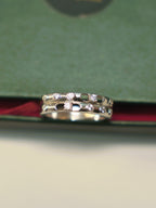 Sterling silver double row band ring with bezel set American Diamonds and oval cut-outs.