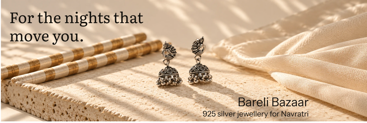 For the nights that move you: peacock jhumkas from Bareli Bazaar beside dandiya sticks