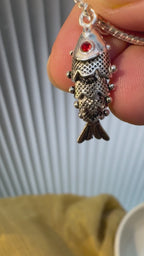 Swimming Fish Silver Pendant with Red Stone Eyes